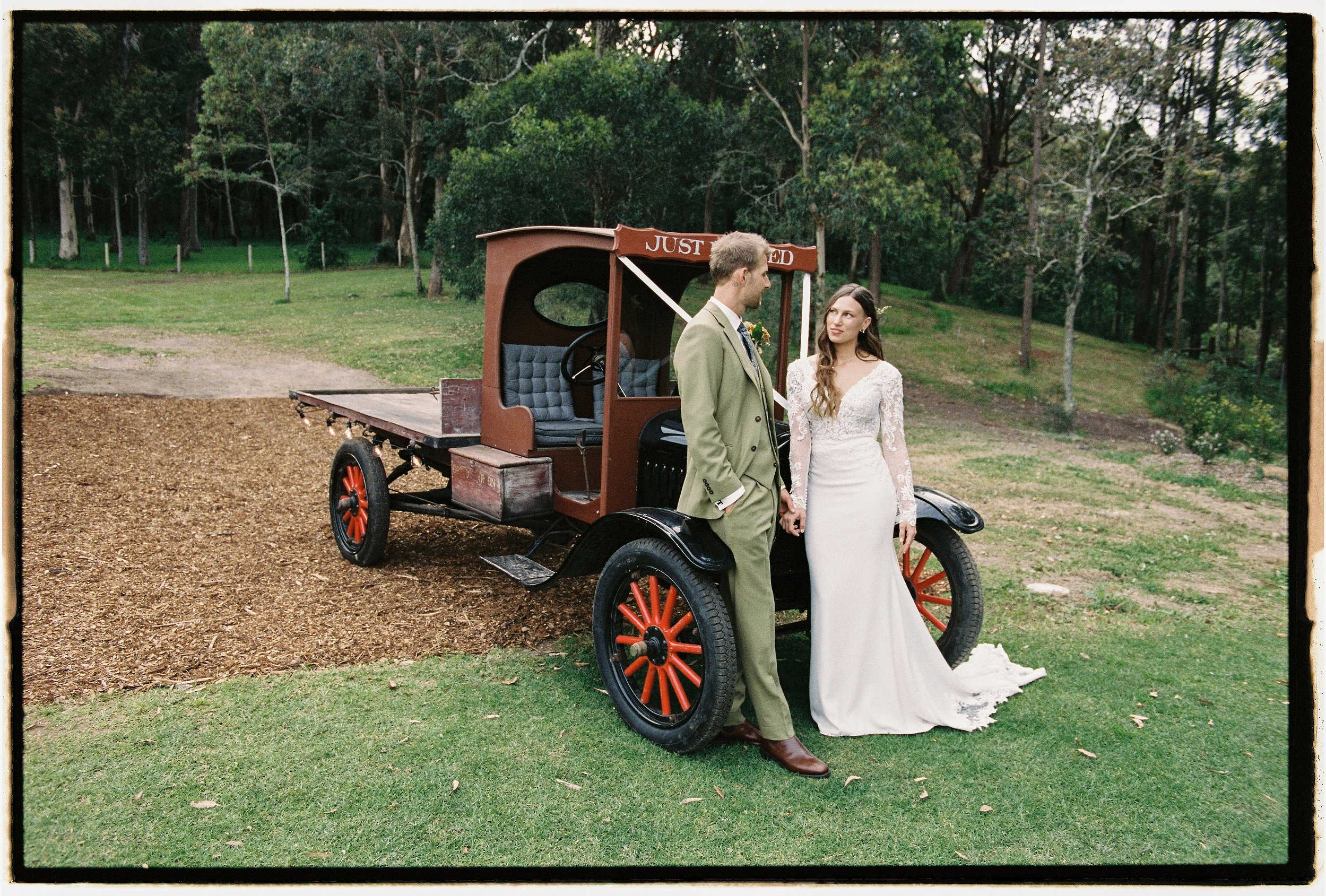 A couple beside a vintage flatbed truck, countryside New South Wales, Lorella Giannini