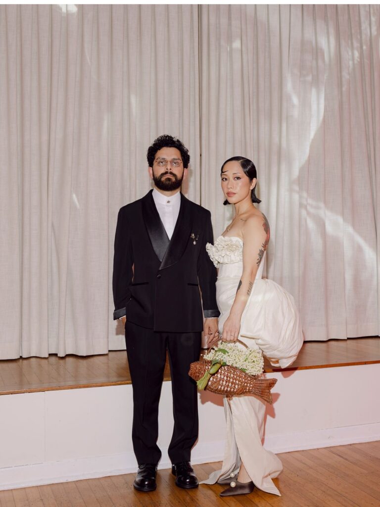 The couple in a curtained doorway, from the Vogue Australia feature, Lorella Giannini