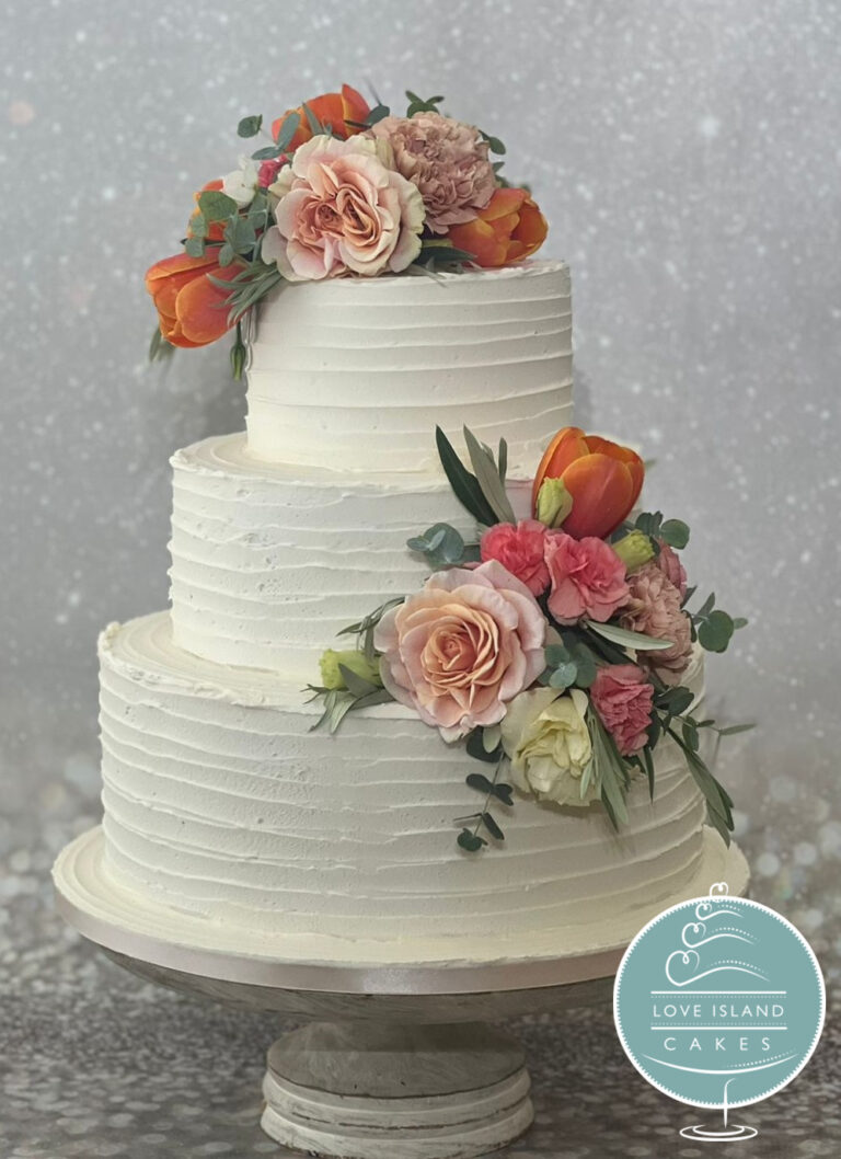 A three-tier ridged buttercream cake with orange and pink roses and tulips, Love Island Cakes