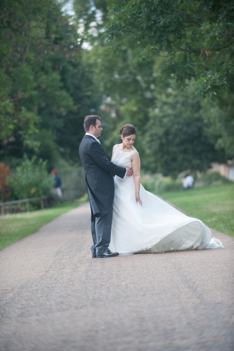 The couple on a tree-lined garden path, Lovexposed Photography