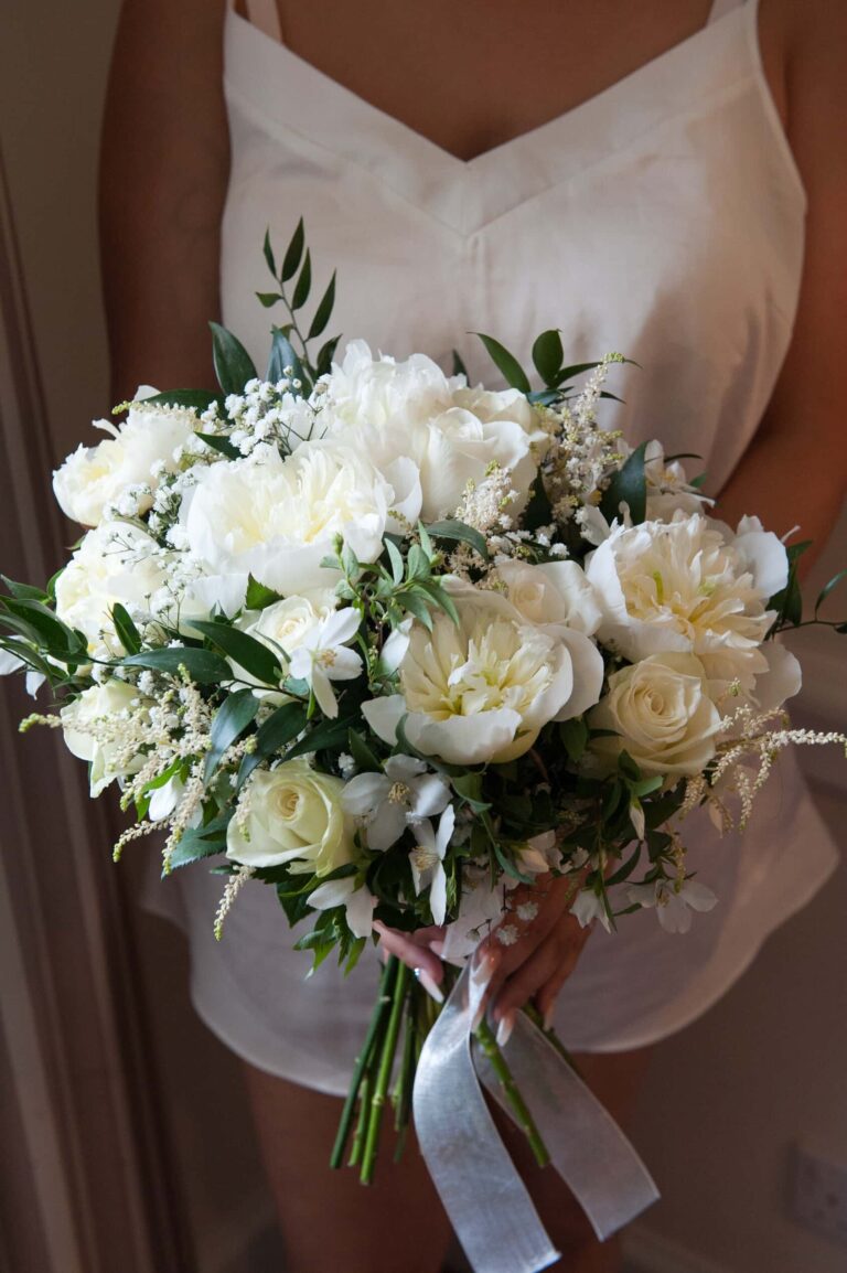 The bride's white rose and greenery bouquet; Joelle and Tashan's wedding at Gilwell, Essex, Lovexposed Photography
