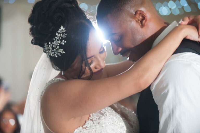 The first dance, close up under the marquee lights; Joelle and Tashan's wedding at Gilwell, Essex, Lovexposed Photography