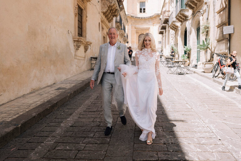 Emily walks through the streets of Noto on her way to the ceremony, LOVIÙ Events