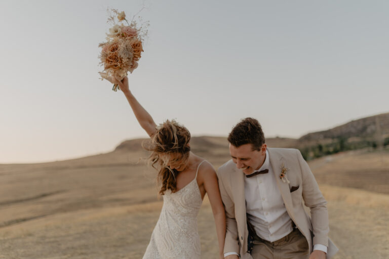 The couple celebrate in the evening light on the hills around Masseria Susafa, LOVIÙ Events