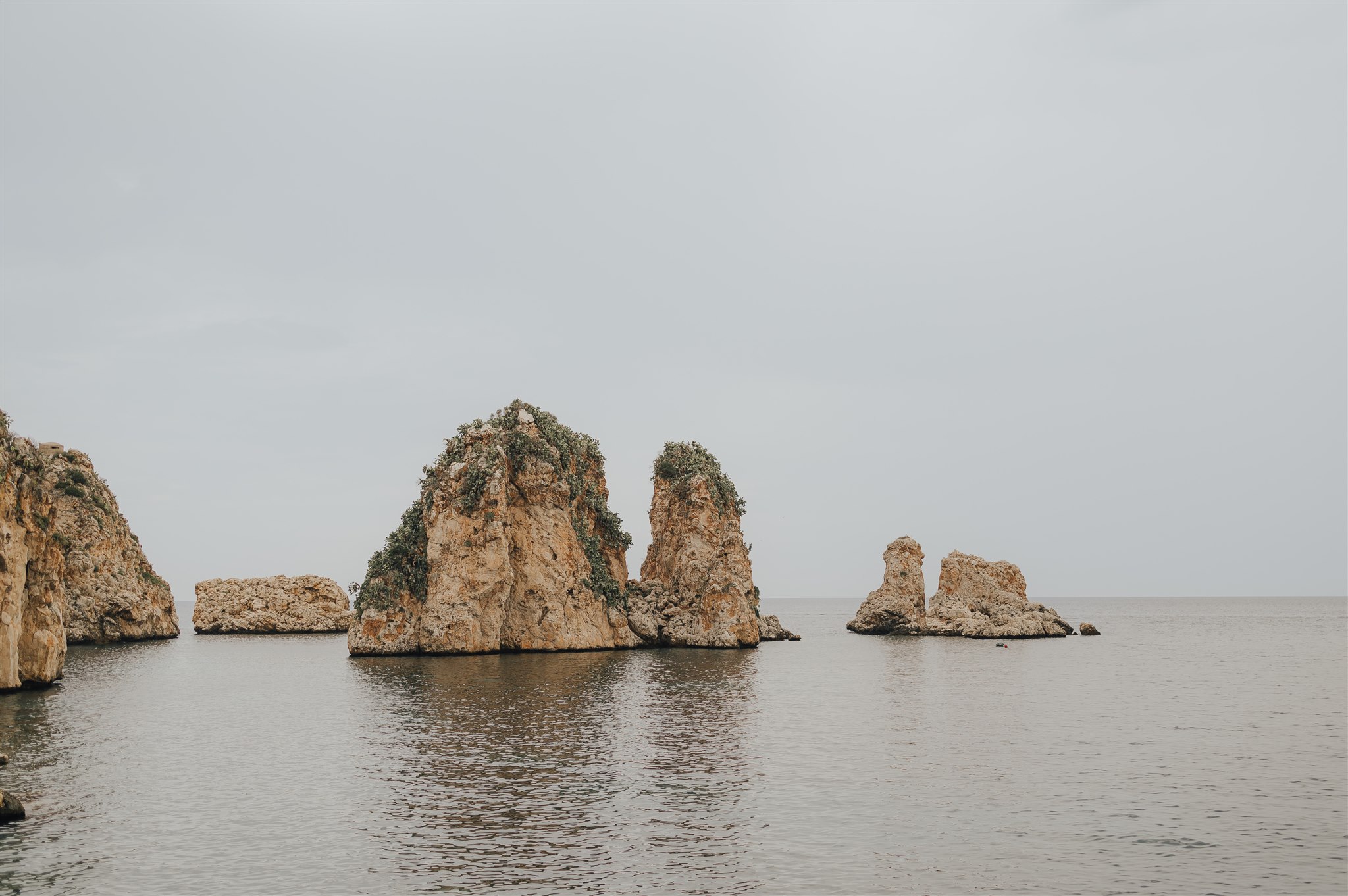 The faraglioni sea stacks off Scopello, on Sicily's north-west coast, from Lisa and Yashar's wedding weekend, LOVIÙ Events
