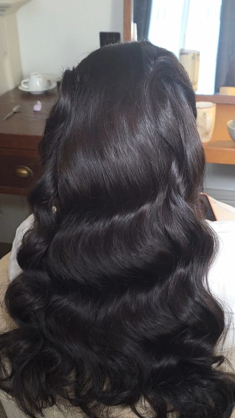 Long dark waves, from behind, at a dresser mirror, Loxus Hair and Makeup