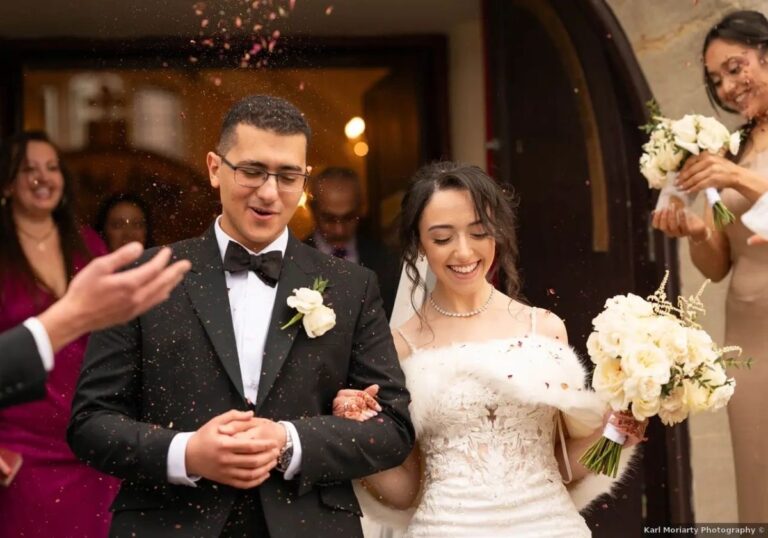 A couple exits the church under a shower of confetti, Loxus Hair and Makeup