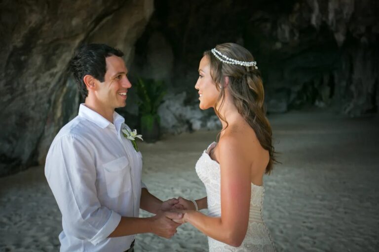 A couple holding hands to exchange vows in a sandy grotto, Rayavadee, Railay, Krabi, Lucida Image