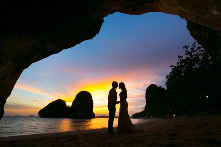 A couple framed by a cave opening at sunset, Railay, Krabi, Lucida Image