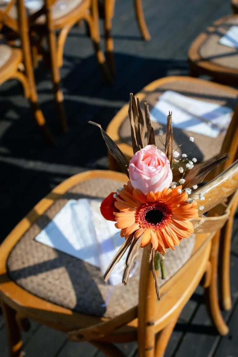 A gerbera and rose posy tied to a wooden ceremony chair, Cape Panwa, Phuket, Lucida Image