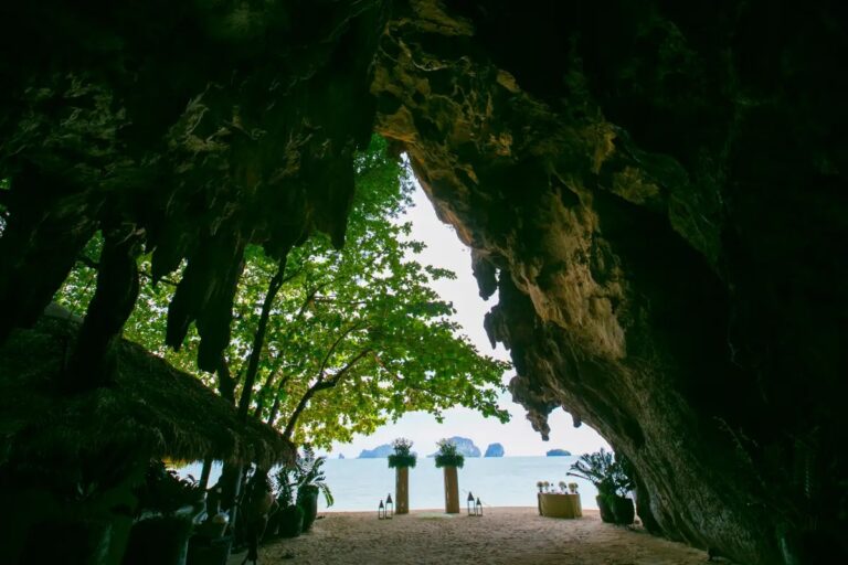 Bamboo columns at the end of a leafy cave passage opening onto the bay, Rayavadee, Krabi, Lucida Image