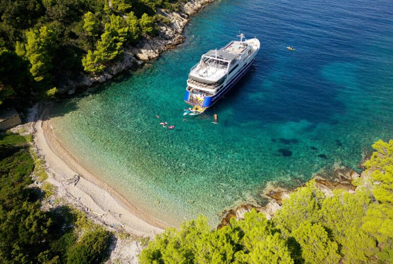 Lupus Mare anchored off a pebble beach, Lupus Mare