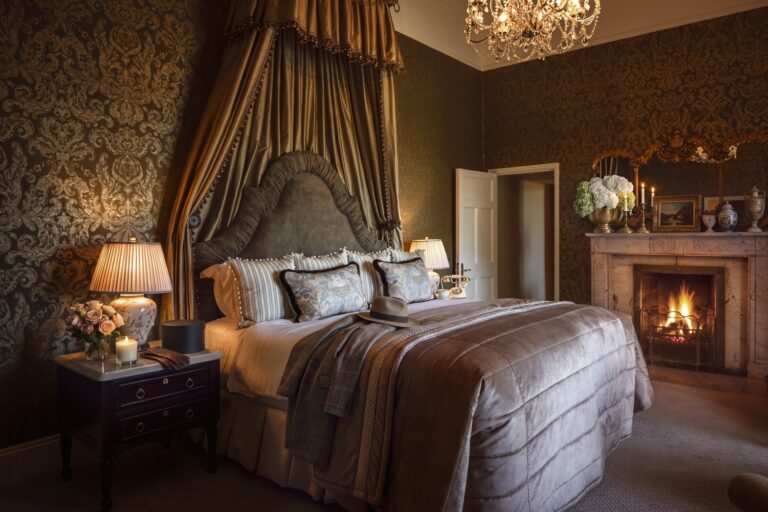 Guinness Suite bedroom with fireplace, Luttrellstown Castle Resort