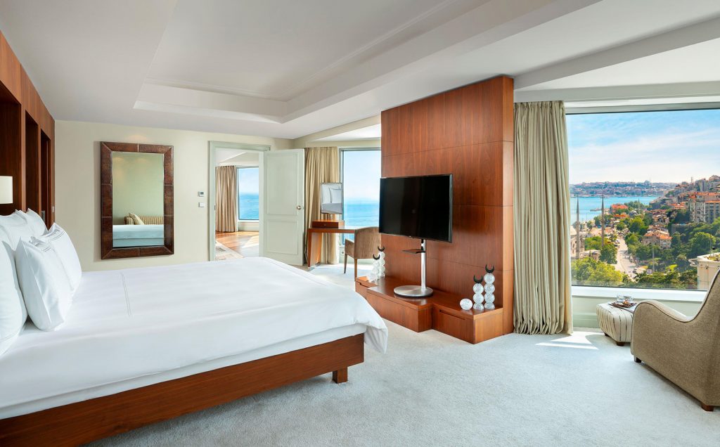 A bedroom with a wide bed and a window onto the Bosphorus