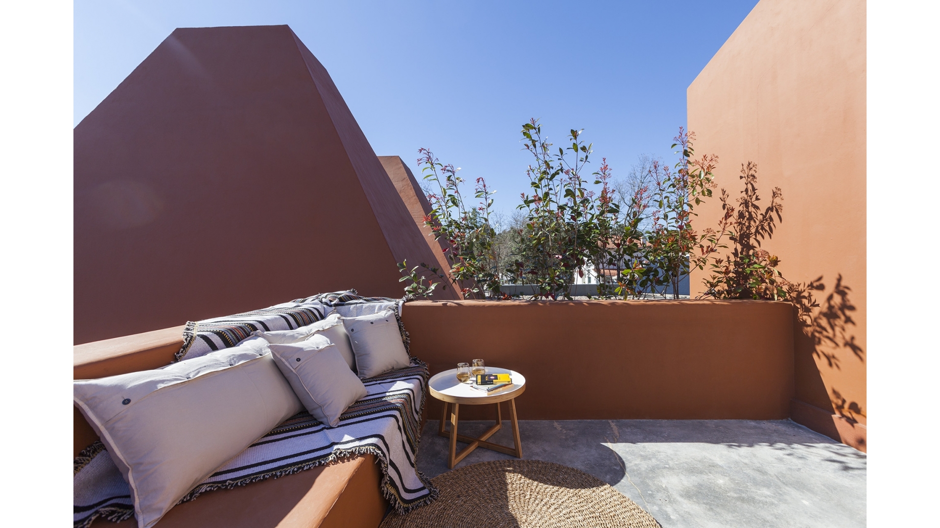Master Suite terrace with cushioned seating, Luz Houses