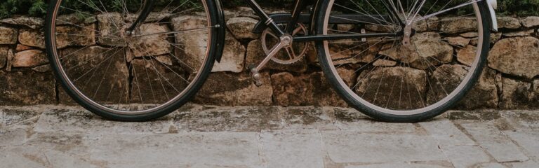 Bicycle against a stone wall in the village, Luz Houses