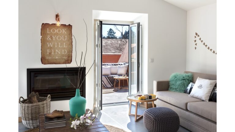 Master Suite living room with fireplace and terrace doors, Luz Houses