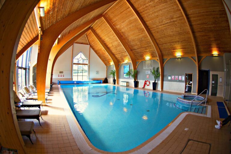 The 16 metre indoor swimming pool beneath the arched timber ceiling of the Armana Spa, Lythe Hill Hotel & Spa