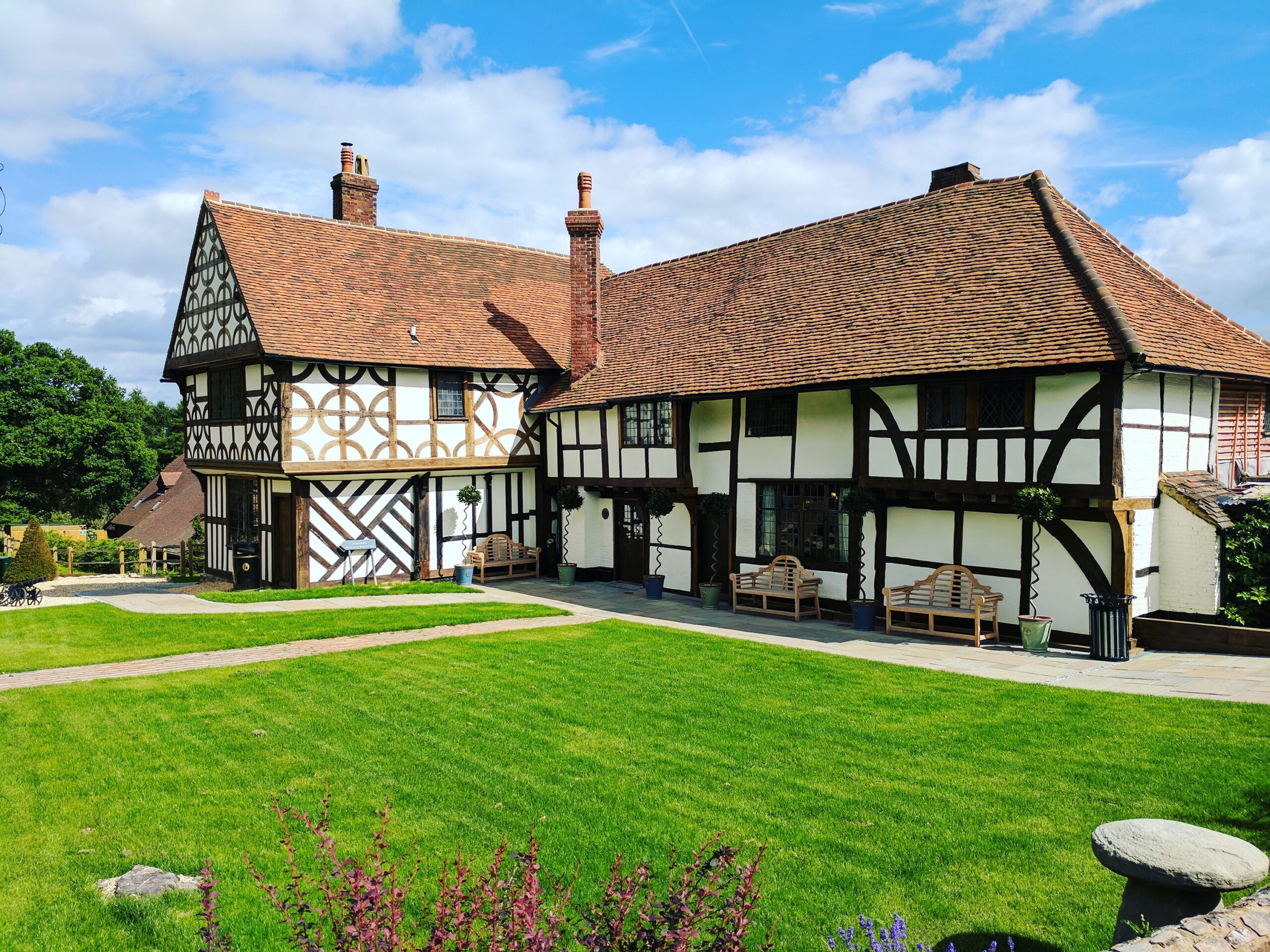 The listed timbered Tudor house of 1475 at Lythe Hill, its black beams and lawns in the Surrey sun, Lythe Hill Hotel & Spa
