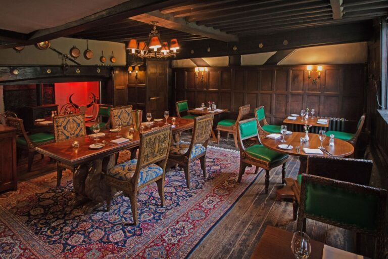 The intimate panelled Oak Room in the historic Tudor house, set for a small gathering, Lythe Hill Hotel & Spa