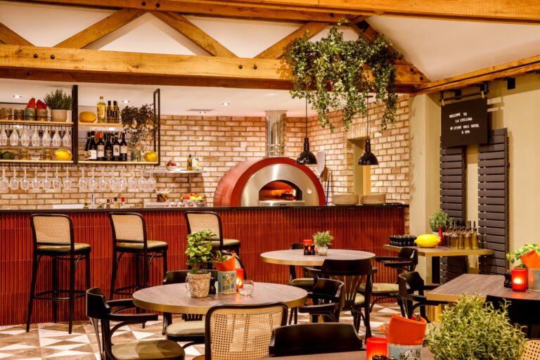The bar and wood-fired pizzeria oven of La Collina beneath the beams, Lythe Hill Hotel & Spa