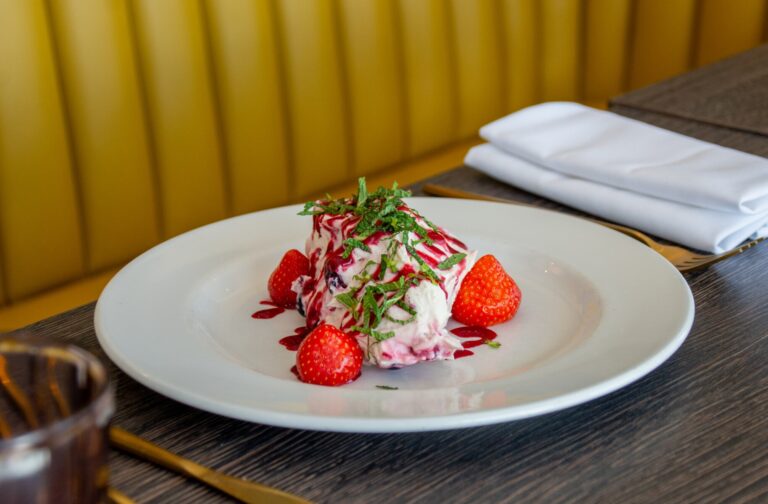 A plated dessert with fresh strawberries and cream, Lythe Hill Hotel & Spa