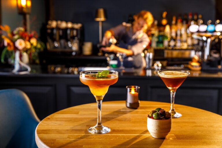 A bartender mixing cocktails at the hotel bar, Lythe Hill Hotel & Spa