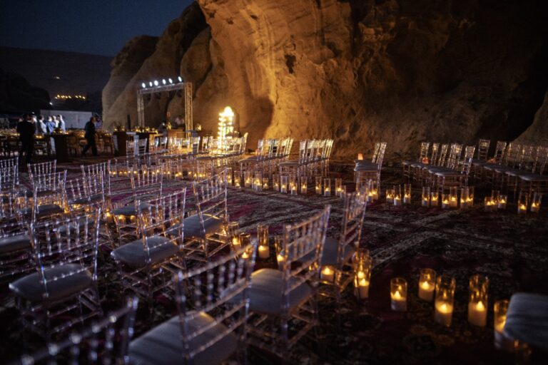 Clear chairs and candles set out for a night ceremony, Mövenpick Resort Petra