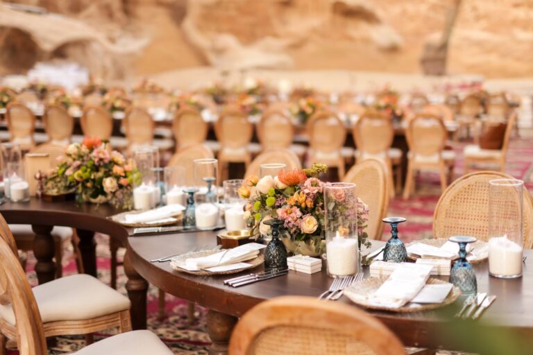 Table setting with floral arrangements and glassware, Mövenpick Resort Petra