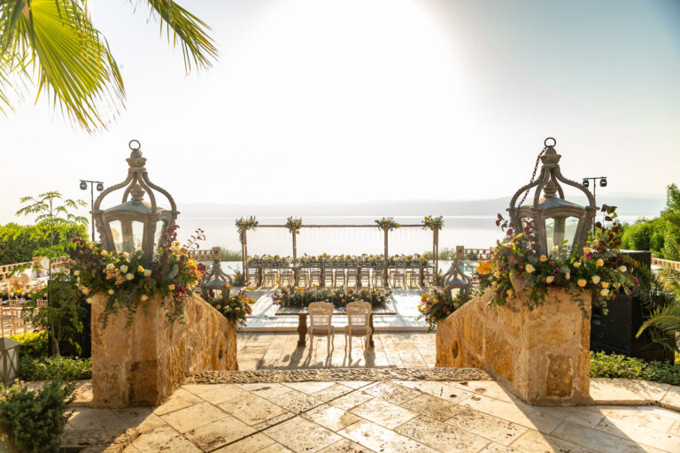 Terrace with lanterns and floral arrangements overlooking the sea, Mövenpick Resort & Spa Dead Sea