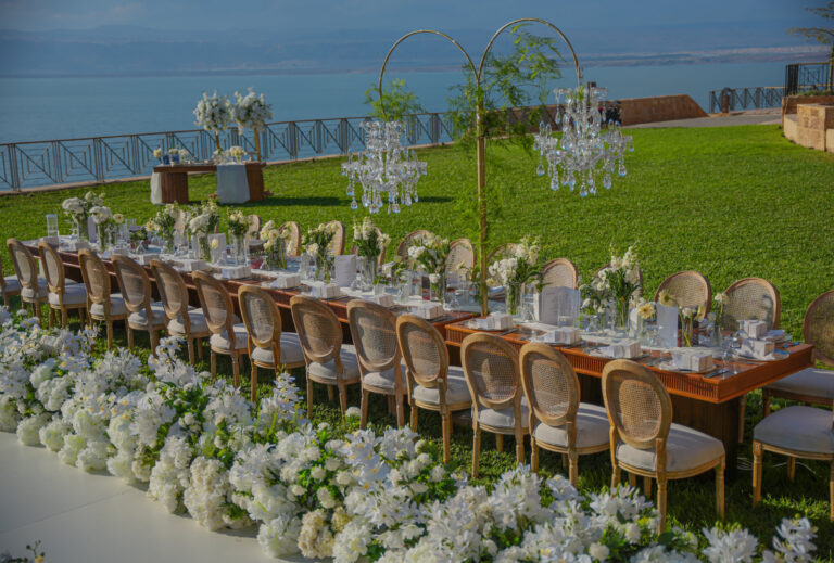 Long banquet table with chandeliers on the lawn, Mövenpick Resort & Spa Dead Sea