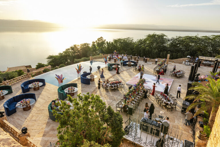 Terrace laid out for a reception with lounge seating, seen from above, Mövenpick Resort & Spa Dead Sea