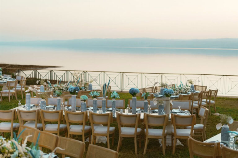 Tables set on the lawn terrace above the Dead Sea, Mövenpick Resort & Spa Dead Sea