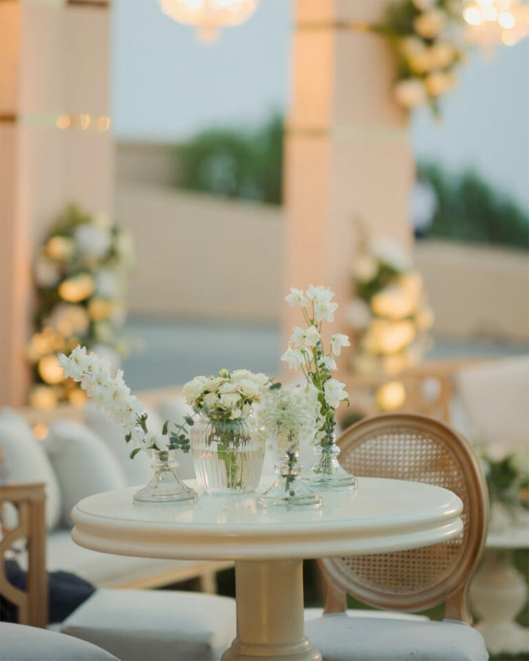 Chandeliers and arched backdrop above a lounge dining set, Mövenpick Resort & Spa Dead Sea