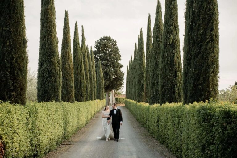 A cypress avenue in Chianti with the couple walking up the middle, Magnolia Wedding Planner