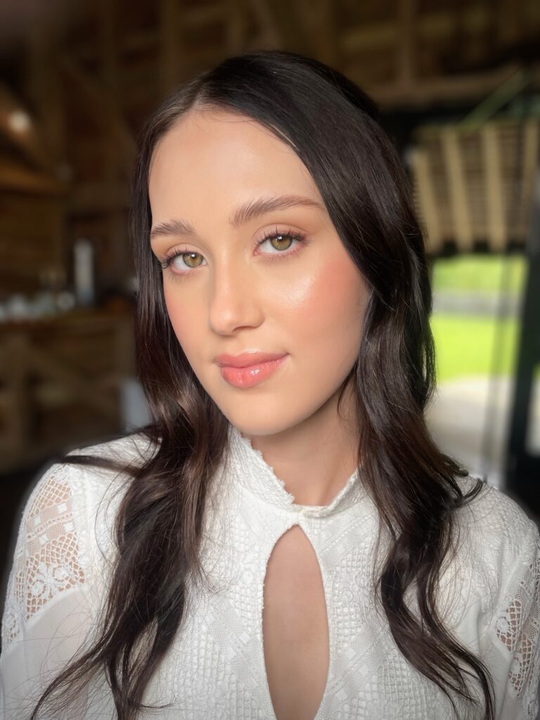 A bride in a lace top with a keyhole neckline and pearl headband, garden light, Makeup By Becky Flynn