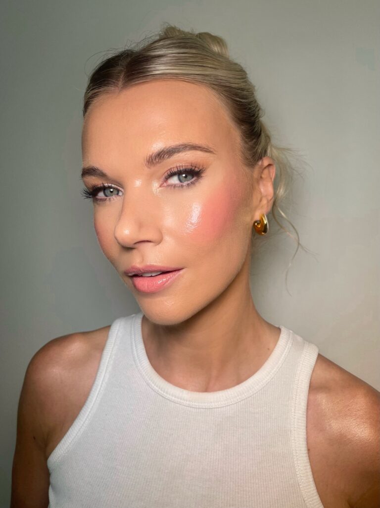 A close beauty portrait in a white vest, dewy glowing skin, Makeup By Becky Flynn