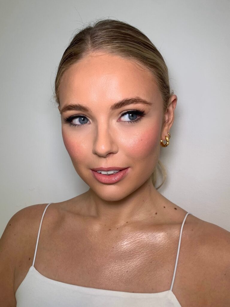 A close beauty portrait, a spaghetti-strap top, dewy skin, Makeup By Becky Flynn