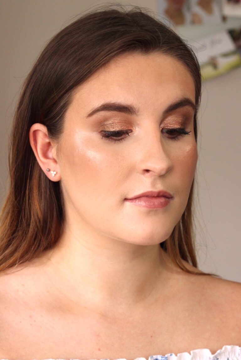 A bride in profile, dark hair, a lace shoulder visible, Makeup By Becky Flynn
