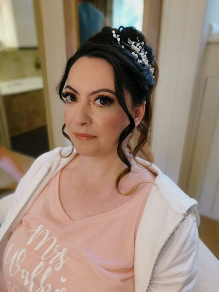 A trial portrait, a jewelled hairpiece, 'Mrs' printed on her top, Makeup By Mirna