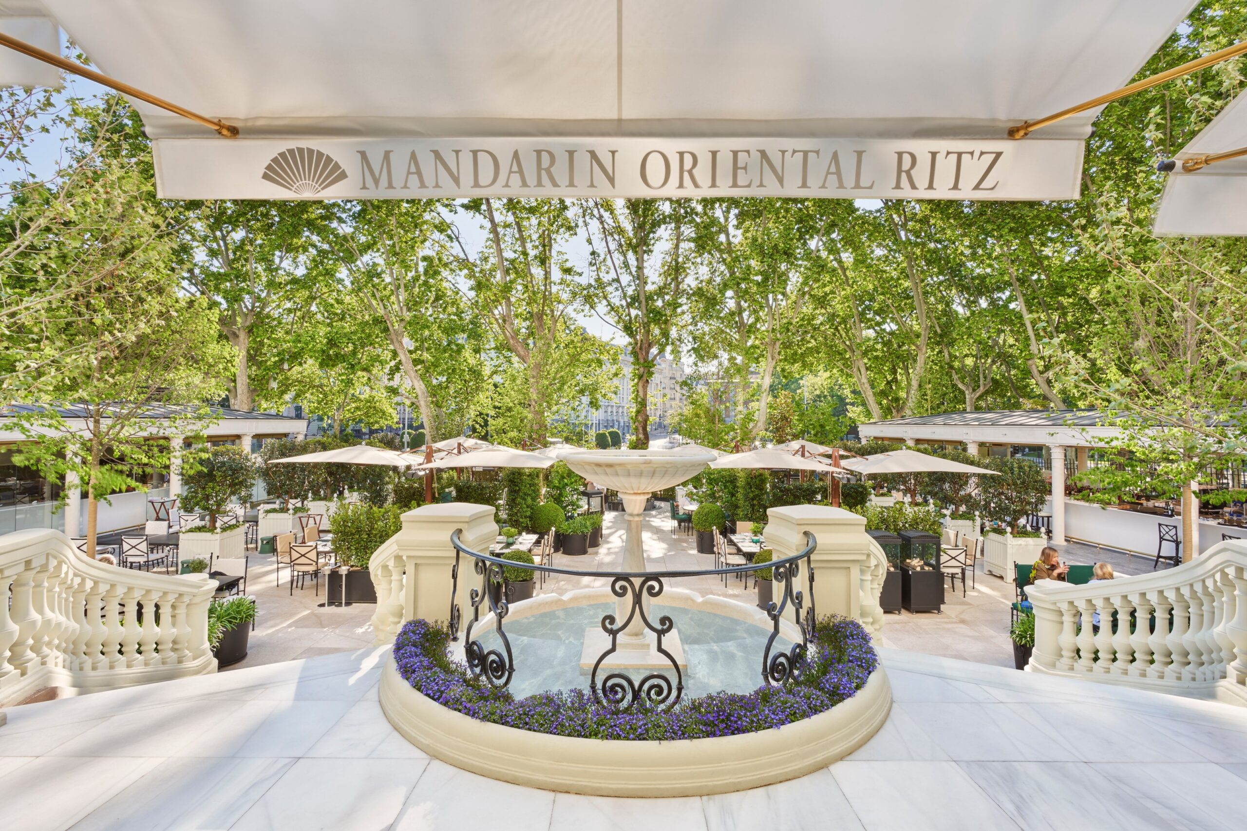 The garden terrace under the hotel sign, Mandarin Oriental Ritz Madrid