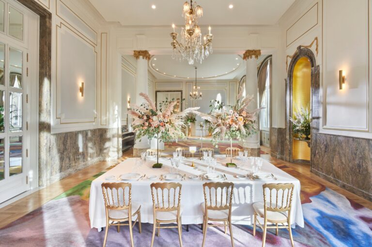 A salon set with a long table and flowers, Mandarin Oriental Ritz Madrid