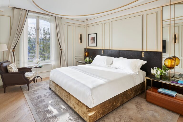 Bedroom with a dark headboard and a sitting area, Mandarin Oriental Ritz Madrid