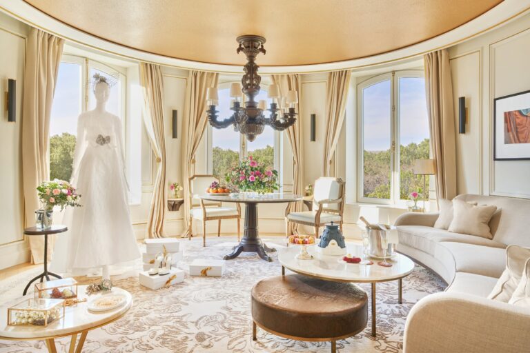 Suite sitting room with a wedding dress on display, Mandarin Oriental Ritz Madrid