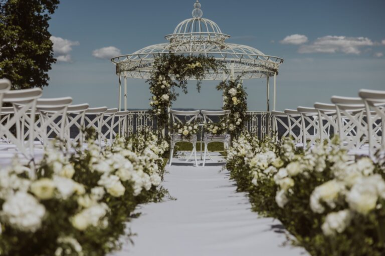Wedding gazebo and aisle with white chairs, Manowce Palace