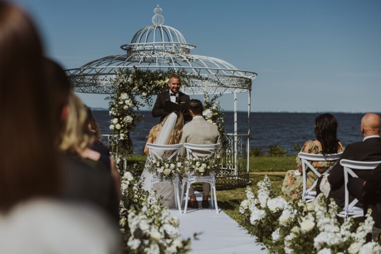 Outdoor civil ceremony at the gazebo above the water, Manowce Palace