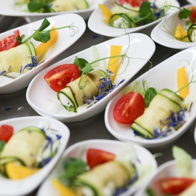 Canapes served on white dishes, Manowce Palace