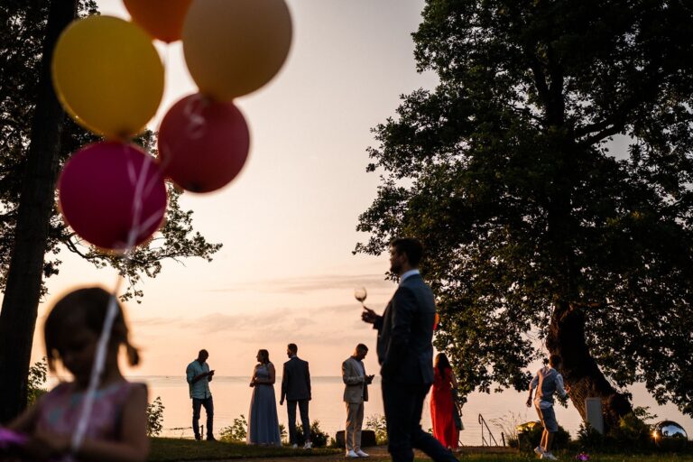 Guests in the garden at sunset, Manowce Palace