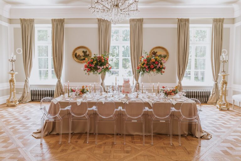 Reception table set beneath a chandelier, Manowce Palace