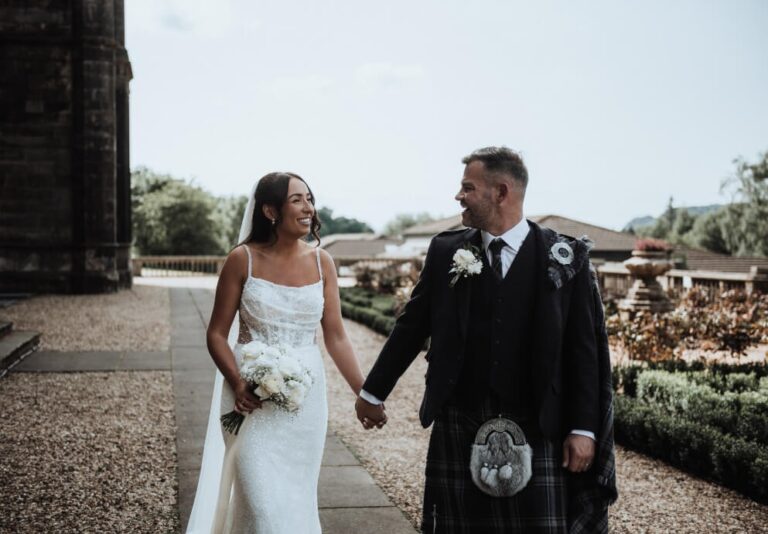 A bride and groom on the terrace at Mar Hall, Mar Hall Golf & Spa Resort